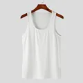 Detailed macro view of white ribbed texture on breathable men's fitness tank top - S / Tops / White