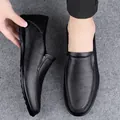 Classic black soft leather slip-on loafers for men with a flexible comfortable flat sole - Black