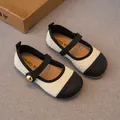 Elegante Mädchen-Mary-Janes aus beigem Tweed mit schwarzer Kappe und goldenem Knopfdetail. - Größe 23 / Innenlänge 14.5cm / Weißschwarz