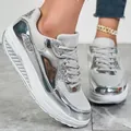 Macro view of silver metallic sneakers featuring glitter panels and a platform sole - 36 / Silver