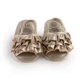 Close-up view of shimmering gold ruffled baby prewalker shoes with soft metallic fabric - 11cm / Gold