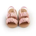 Close-up of pink ruffled summer baby girl sandals with elastic heel strap - 11cm / Pink