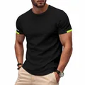 Close-up detail of a men's athletic quick-dry black sports t-shirt with neon sleeve accents - S / Tops / Black