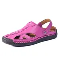 Detail view of the vibrant pink hollow-out summer sandal with sturdy black rubber sole - 36 / Rose Red