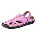Close-up of pink hollowed-out sandals with hand-stitched edges and durable rubber sole - 36 / Pink