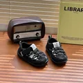 Close-up of black breathable baby sandals with protective toe cap and hook-and-loop closure - Size 22 (Insole 14.5cm, Fit Foot Length 13.5-14cm) / Black