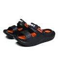 Detailed side view of black and orange outdoor sports sandals with heel strap - Black Orange Floral