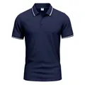 A classic navy blue short-sleeved polo shirt featuring white striped details on collar and cuffs - S / Tops / Navy Blue