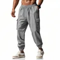Detailed view of men's grey linen cargo pants featuring drawstring waist and elastic cuffs - S / Bottoms / Medium Grey