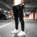Men's solid black cargo jogger pants featuring drawstring waist and large side pockets - Black