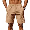Dettaglio dei pantaloncini in lino kaki da uomo con coulisse e vestibilità comoda. - Giallo ocra