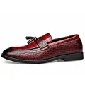 Elegant burgundy men's loafers with crocodile pattern leather and tassel detail. - Red
