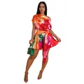 Detailed view of a colorful floral print one-shoulder romper with a waist tie - S / Dresses / Red