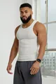 Detail shot of white ribbed fabric texture and athletic fit on a men's sports tank top - M / Tops / White
