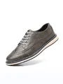 Moderner grauer Brogue-Schnürschuh aus Leder für Herren mit eleganten Ziernähten - 40 / Grau