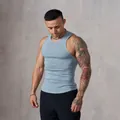 Close-up of men's blue ribbed sports tank top showing muscle fit and knit texture. - M / Tops / Light Blue