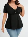 Dettaglio di un top nero da donna con scollo a V, vita segnata e bottone decorato. - XL / Top / Nero