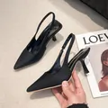 Detailed close-up of elegant black pointed toe slingback sandals with stiletto heels. - 35 / Black