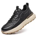 Professional men's black casual sports sneaker with a thick cream sole and textured upper - 38 / Black