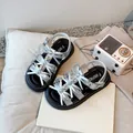 Stylish silver girls' sandals featuring rhinestone bows and comfy thick black soles - Size 23 (Inner Length 14.6cm) / Silver