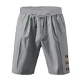 Graue legere Leinenshorts mit Kordelzug und dekorativen Knöpfen - S / Unterteile / Grau
