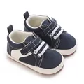 Close-up of navy blue canvas baby shoes with velcro strap and soft non-slip sole. - Dark Blue