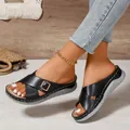 Stylish women's black wedge sandals featuring cross straps and decorative metal buckles - 36 / Black