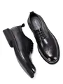 Overhead and side view of black leather brogue shoes with thick soles and wingtip details - 38 / Black