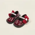 Zapatos de charol granate para bebé niña con lazo rojo y tira de pedrería - Longitud Interior 11.5cm / Burdeos