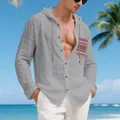 Detailed view of men's grey linen hooded shirt with a unique bohemian print pocket detail. - Dark Gray