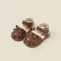 Elegant brown baby girl sandals featuring a charming bowknot and hollow-out floral patterns. - Brown