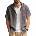 Detailansicht eines grauen Leinenkapuzenshirts mit bohemischem Taschendesign - S / Oberteile / Dunkelgrau