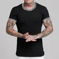 Men's black athletic ribbed T-shirt with white striped trim on collar and sleeves - S / Tops / Black