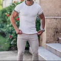 Men's white athletic ribbed short sleeve t-shirt with striped trim and slim fit design - White