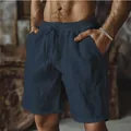 Primo piano di pantaloncini in cotone e lino blu navy con elastico in vita e lacci - Blu navy