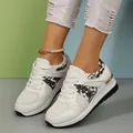 Detail of women's white platform sneakers with breathable mesh and floral embroidery - White