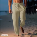 Close-up detail of men's breathable light khaki linen beach pants with drawstring - Khaki