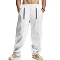 Men's loose white linen trousers featuring bohemian embroidery and drawstring waist - White
