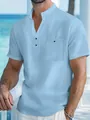 Détail d'une chemise en lin bleu clair pour homme avec col montant et poche poitrine - S / Hauts / Bleu clair