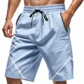 Pantaloncini sportivi azzurri da uomo con tasche a zip e strisce bianche laterali - Taglia S / Pantaloni e gonne / Azzurro