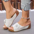 Detail view of white wedge sandals with flower decoration and laser-cut perforations - 36 / White