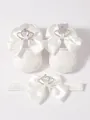 Detailed view of white lace baby shoes with rhinestone crowns and satin bows. - Crown Bowknot Style (With Headband) / Size 11 (Inner Length 10.5CM) / White