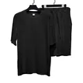 Detalle del conjunto de camiseta de manga corta y pantalón corto con textura de rayas - Negro
