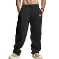 Close-up detail of breathable black linen wide-leg casual trousers for men showing fabric texture - S / Bottoms / Black