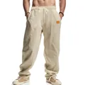 Close-up of the textured fabric and drawstring waist on these beige men's linen casual pants - S / Bottoms / Khaki
