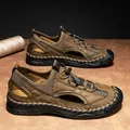Zijaanzicht van bruine leren outdoorsandalen met ademende inzetstukken van mesh - Donkerbruin (92009)