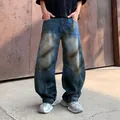 Men's loose fit tapered blue washed denim jeans with heavy distressed fading patterns - S / Cuffed Style (1337) / Blue / Bottoms