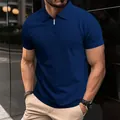 Close-up of men's navy blue knit polo shirt featuring a sleek half-zip collar - Navy Blue
