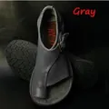 Detail view of gray toe-loop flat sandals featuring adjustable buckle strap - 35 / Gray