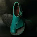 High-angle detailed view of teal leather toe-loop sandals with adjustable metal buckle - 35 / Blue